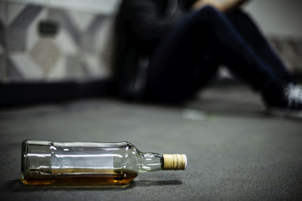 Liquor Alcohol Bottle Lying on The Floor